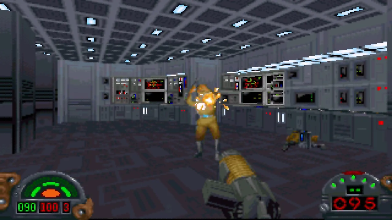 Standbild aus dem Videospiel Star Wars: Dark Forces. Der Raum ist ein futuristischer Computerraum, der im 2,5D-Pixel-Art-Stil gestaltet ist. Du hältst eine Waffe und schießt auf einen Gegner vor dir.